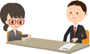 A cartoon image of two people wearing formal clothes in an interview situation.