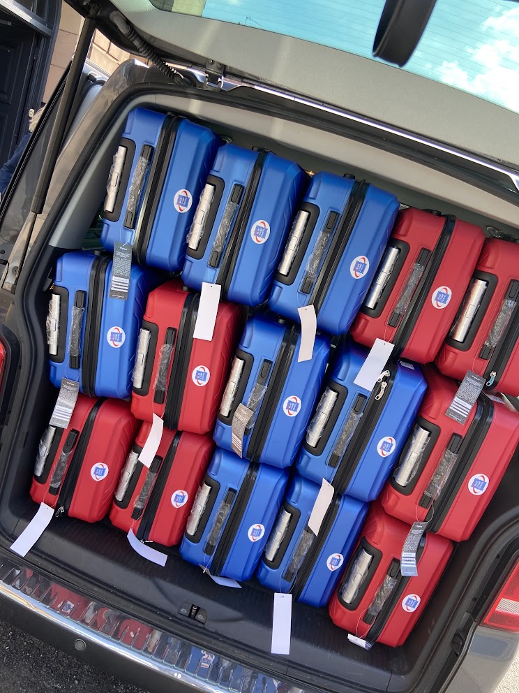 Suitcases squeezed into a car, adopt minimalist packing to avoid this.